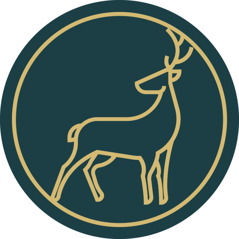 A deer enclosed in a gold-outlined circle